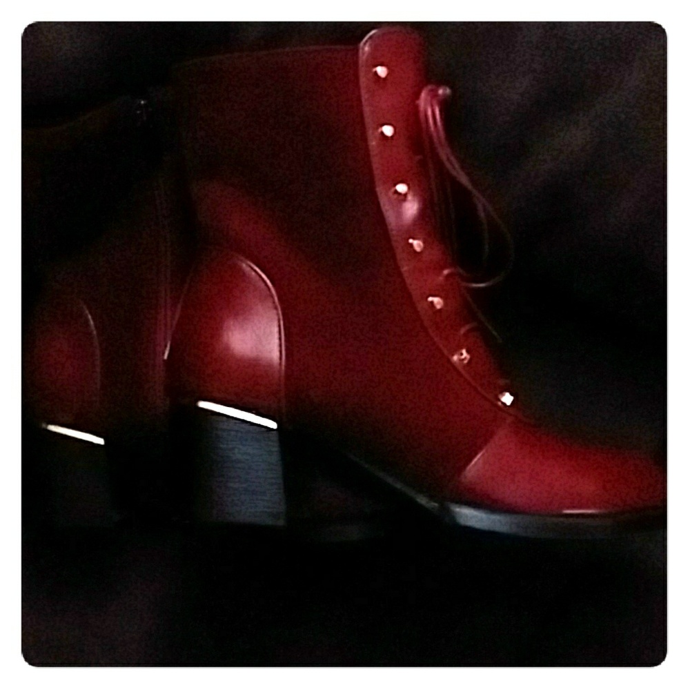 Red boots with lace up gold trim